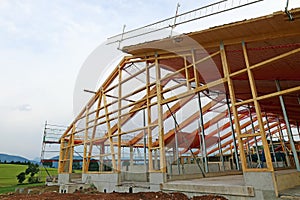 The new building of a timber house with roof framework