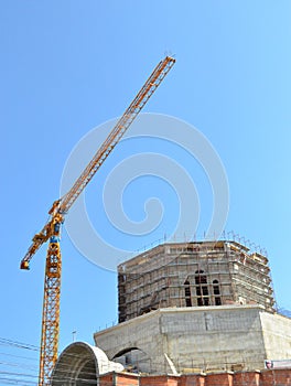 New building under construction with crane