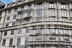 New building under construction, scaffolding and concrete