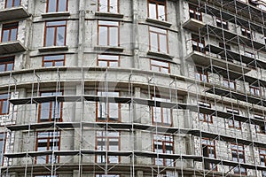 New building under construction, scaffolding and concrete