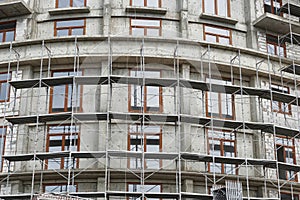 New building under construction, scaffolding and concrete