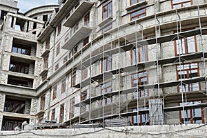 New building under construction, scaffolding and concrete