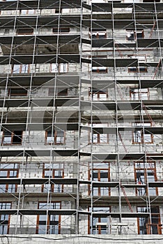 New building under construction, scaffolding and concrete