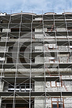 New building under construction, scaffolding and concrete