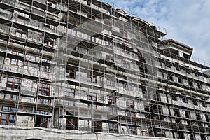 New building under construction, scaffolding and concrete