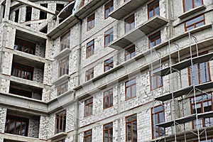 New building under construction, scaffolding and concrete