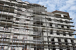 New building under construction, scaffolding and concrete