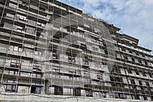 New building under construction, scaffolding and concrete