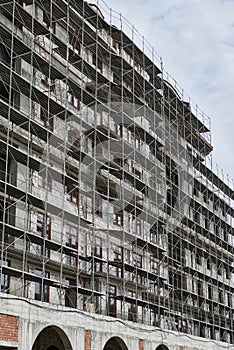 New building under construction, scaffolding and concrete