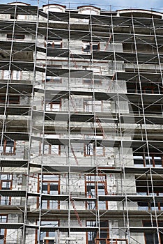 New building under construction, scaffolding and concrete