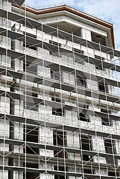 New building under construction, scaffolding and concrete