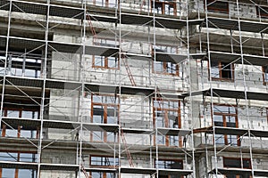 New building under construction, scaffolding and concrete