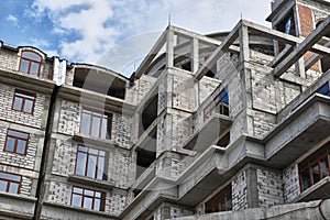 New building under construction, scaffolding and concrete