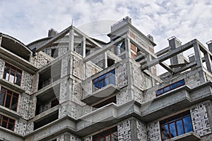 New building under construction, scaffolding and concrete