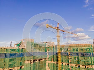 New buildings being constructed. Industrial building site. Shot of lifting crane and skyscraper under construction