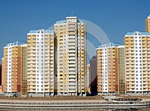 New buildings over blue clear cloudless sky