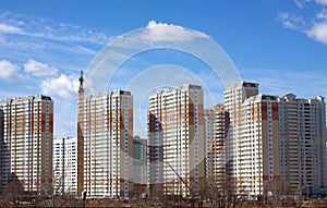 New buildings over blue clear cloudless sky