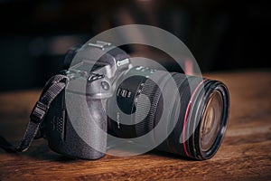 New camera Canon EOS R 30.1 megapixel full-frame mirrorless interchangeable-lens on the table