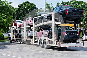 New car on big trailer, delivery shipment