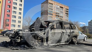 New car burned to the ground in the middle of a sleeping area.