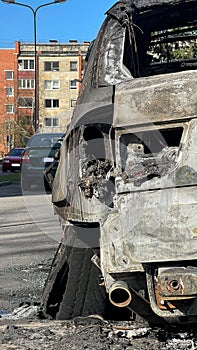 New car burned to the ground in the middle of a sleeping area.