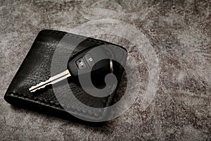 New car keys and wallet with car loan problems