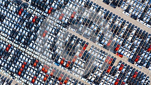 New car lined up in the port for business car import and export logistic, Aerial view