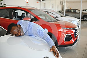 New Car Owner. Happy African American Man Touching Hugging His Brand-New Auto