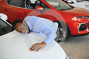 New Car Owner. Happy African American Man Touching Hugging His Brand-New Auto