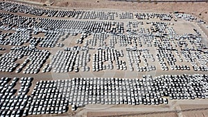 New cars covered in protective white sheets