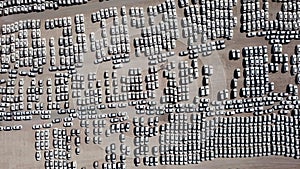 New cars covered in protective white sheets