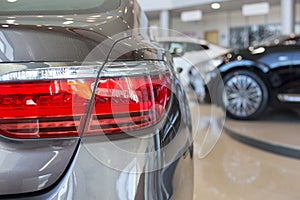 New cars at dealer showroom. Car auto dealership