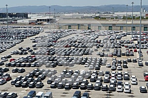 New cars from different producers recently discharged from cargo ships in Barcelona port.