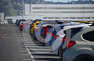 New Cars Lined Up in a Parking Lot