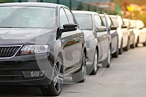 New cars parked in front of a car, motor dealer store, shop in queue