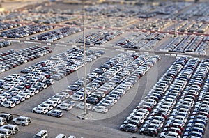 New cars in rows stored at port Rashid in Dubai, UAE