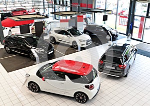 New cars in the sales area of a car dealership - building and ar