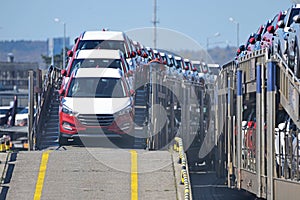 Transportation of new cars on railway platforms. photo