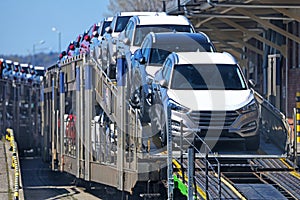 Transportation of new cars on railway platforms. photo