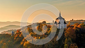 The New Castle in Banska Stiavnica at sunrise in an autumn