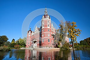 New Castle and moat in the park Muskauer during autumn in Germany