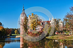 New Castle and pond in the park Muskauer during autumn