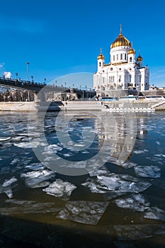 The new Cathedral of Christ the Saviour and the Patriarchy pedestrian bridge over the Moscow River in Moscow. Russia.