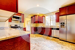 New cherry wood kitchen with stinless steal appliances.