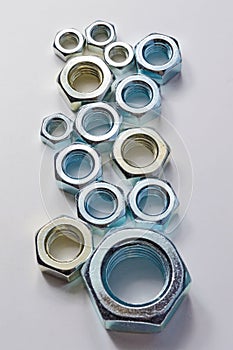 New chrome screw-nut of different sizes.
