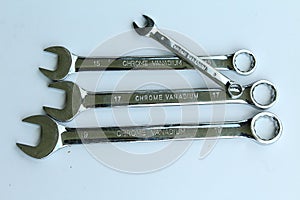 New chrome vanadium wrenchs on white background.Tools for plumbers and motor vehicle mechanics.