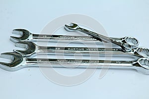 New chrome vanadium wrenchs on white background.Tools for plumbers and motor vehicle mechanics.