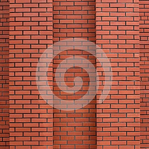 New and clean red brick wall with two columns