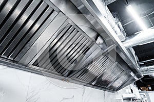 New clean stainless steel hood in professional kitchen