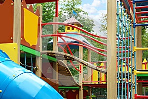 New colorful castle playhouse with climbing frame on children`s playground